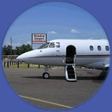 Plane in front of Minden Sign